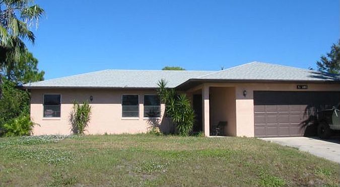 Front of house not showing 2 palms