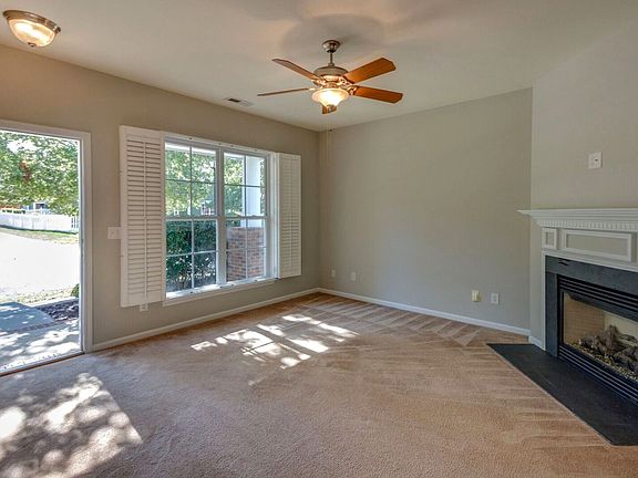 Welcoming.  Plantation Shutters in Living Room.