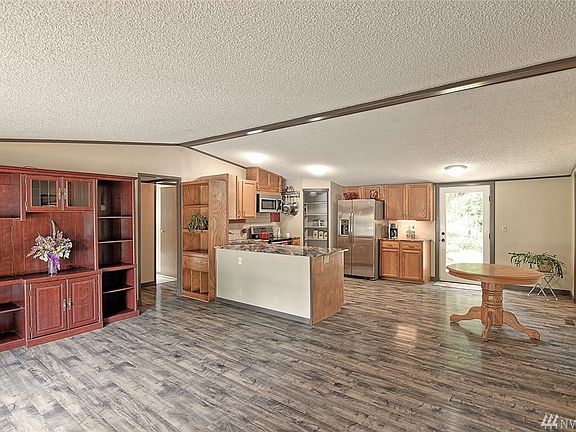 Open floor plan with vaulted ceilings invites you in! 