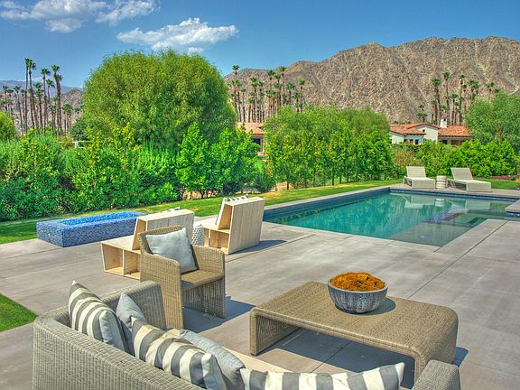 Seating area just outside guest suite w amazing western mountain views and firepit