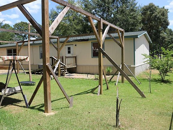 Huge unfinished covered deck in the backyard