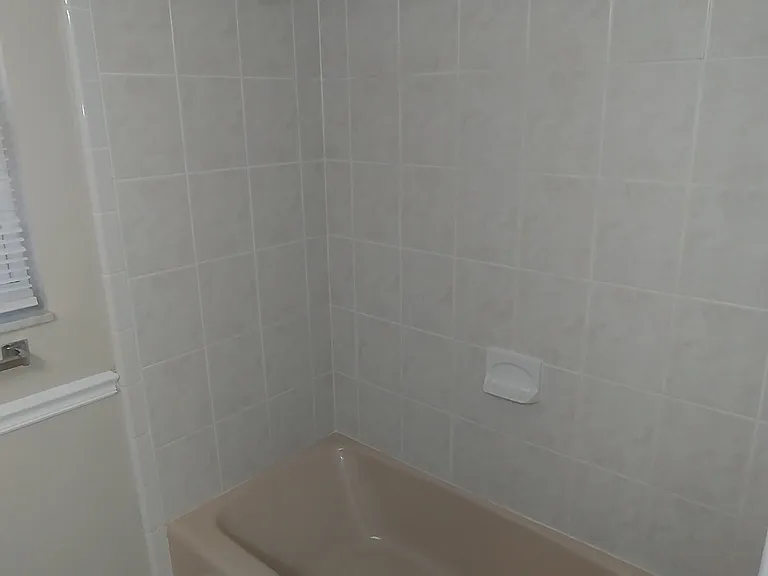 Guest bath rm. has a full bathtub for soaking.