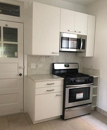 This image shows one side of the new kitchen - all new appliances and cabinets