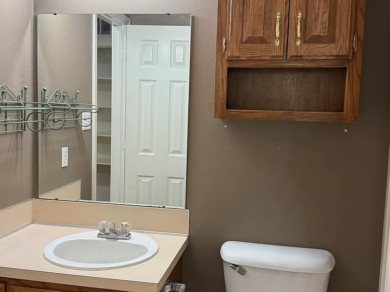 Hallway bathroom from bedroom entry.