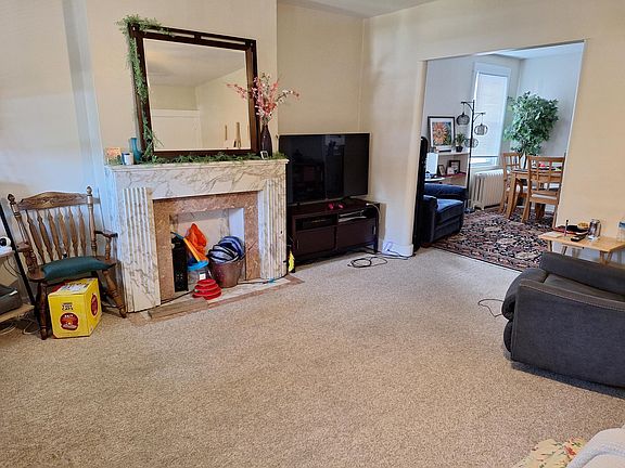 Lovely Spacious Livingroom * Neutral Wall to Wall Carpeting Throughout * Deco Fireplace