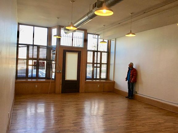 Creators! You will LOVE this large studio space in front. It is the WORK part of this live - work home. Or it can be additional living, with plenty of room as an extra bedroom.