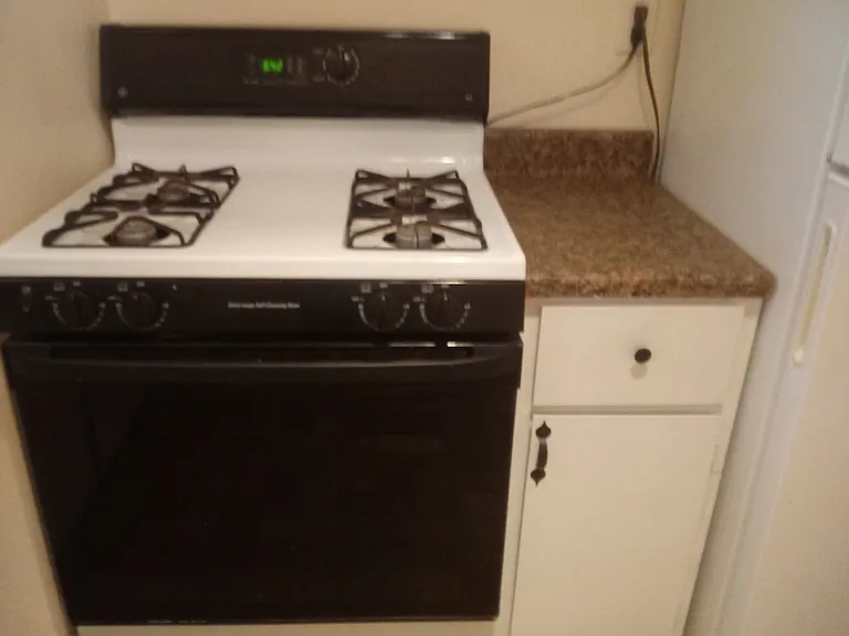 Gas stove and cabint next to it