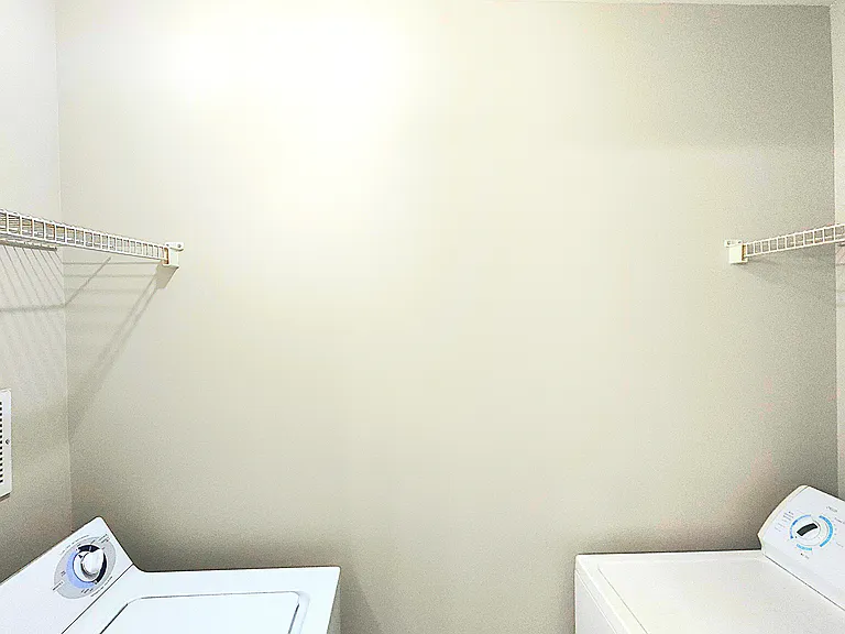 Laundry room inside of master bathroom