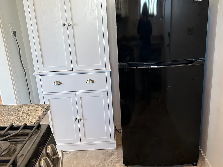 Extra storage cabinet in kitchen.