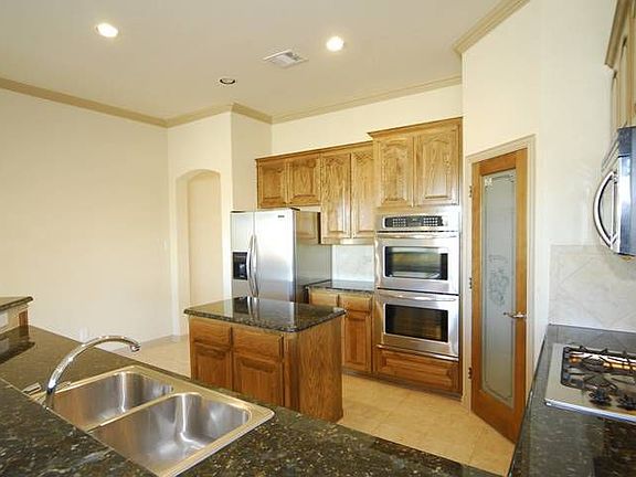 Check out the kitchen - granite countertops, double ovens, and island!
