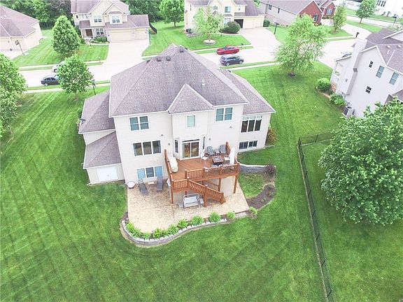 Great view of the back side of the landscaped home