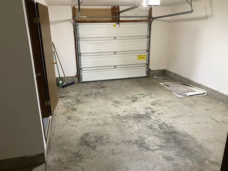 Garage with storage closet on left