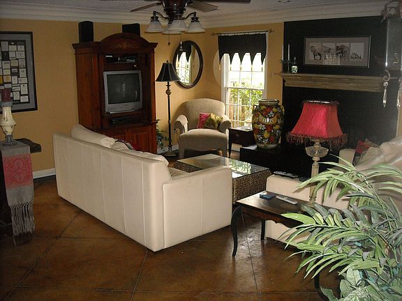 A warm livingroom with scored concrete floors.