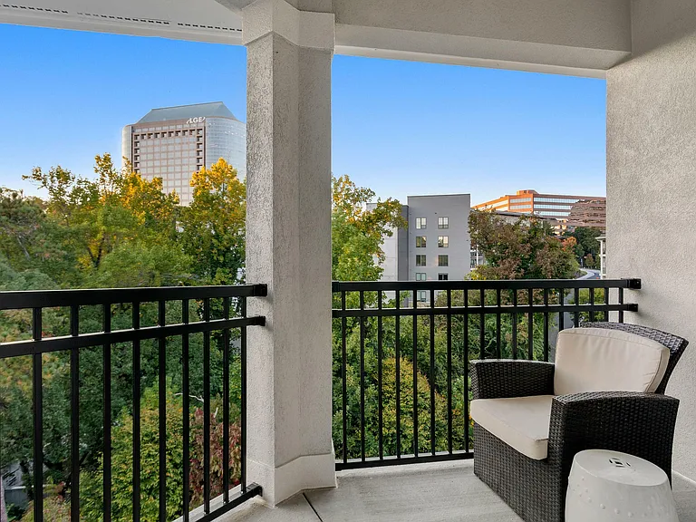 Relax and enjoy the serene city views from your private balcony.