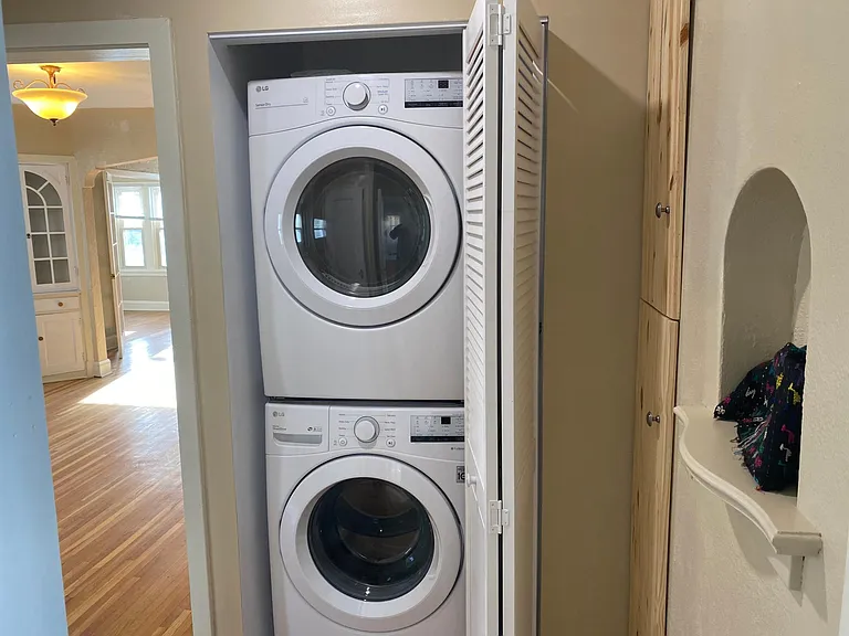 Private laundry area with new appliances.