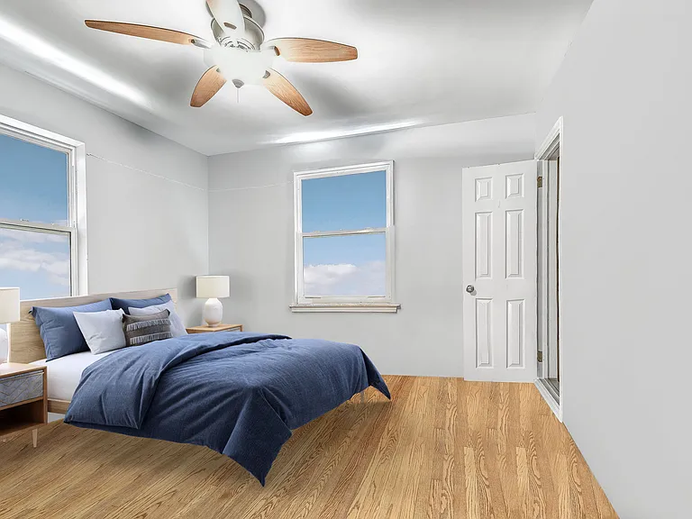 Main level first bedroom can hold queen or king-size bed and desk and dresser