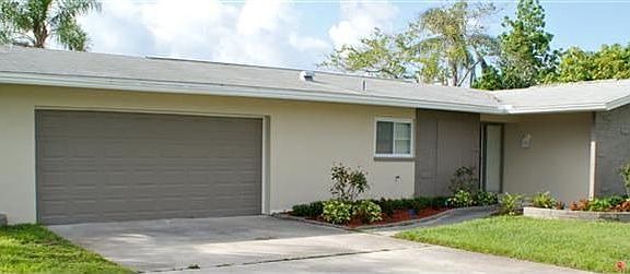 Front of house- Freshly painted with two-car garage.