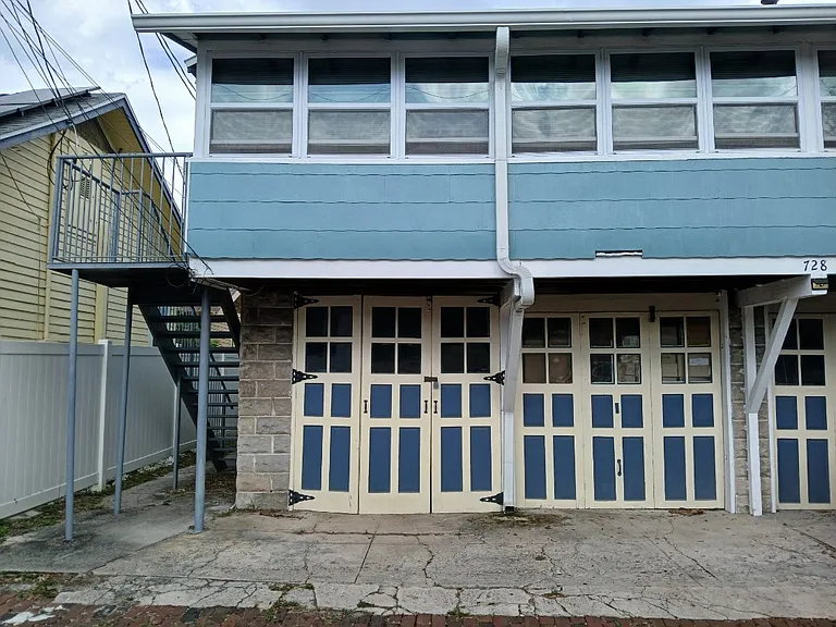 parking spot in front of 2 garage doors.