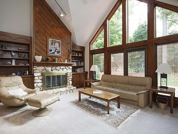 cathedral ceilings, gas fireplace, floor to ceiling wondows