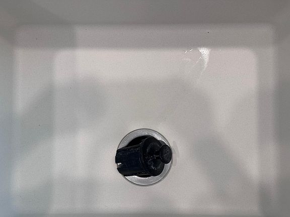 Granite composite sink with garbage disposal.