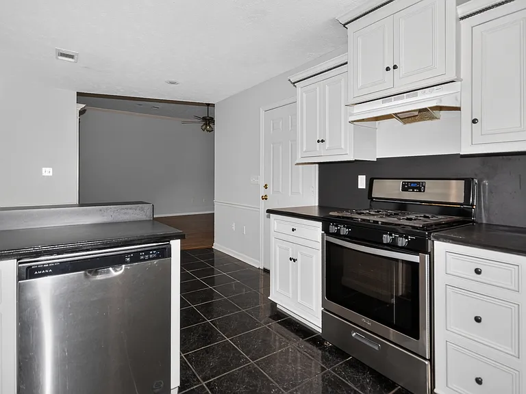 Kitchen with a natural gas stove.