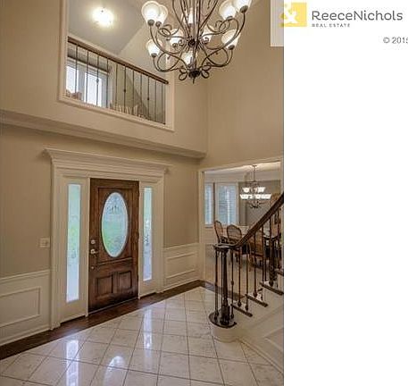 BALCONY FROM MASTER SUITE OVERLOOKS 2 STORY FOYER