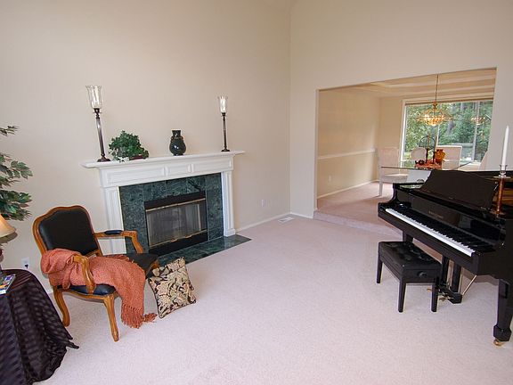 Sun-drenched formal living room with voluminous ceilings