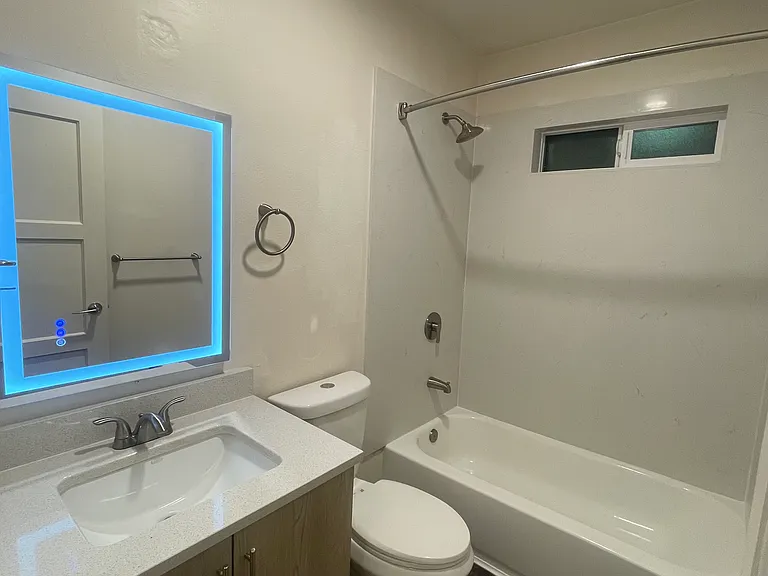 Remodeled bathroom with quartz shower and touch light up mirror.