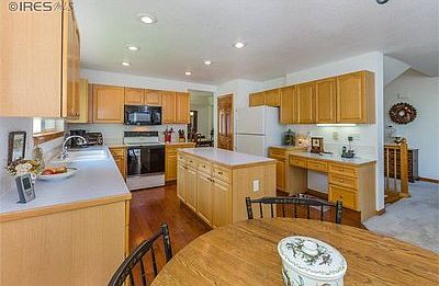 Eat-in kitchen with wood floors