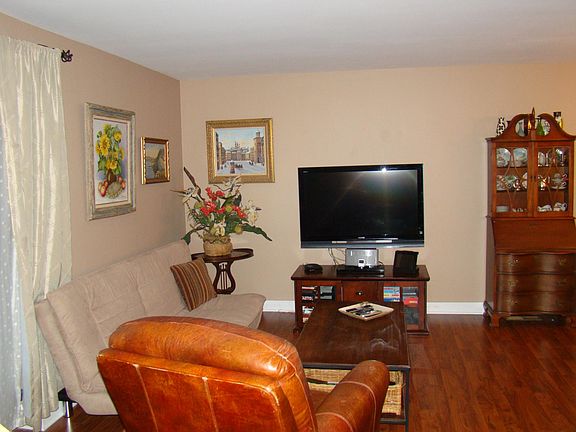 Living room- flooring has been changed to lighter wood.