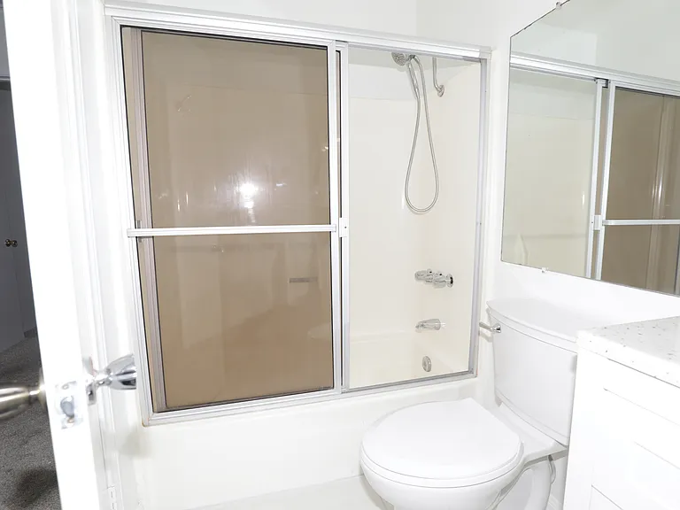 Second bathroom with sliding door access to bathtub shower