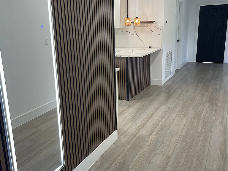 looking from the main bathroom to the entrance door