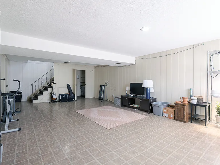 Large finished 1st floor can be used for nonconforming 3rd bedroom. Has half a bath