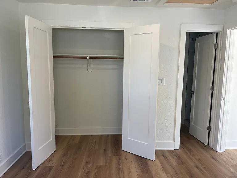 Doors to closet and bathroom in bedroom ensuite 1