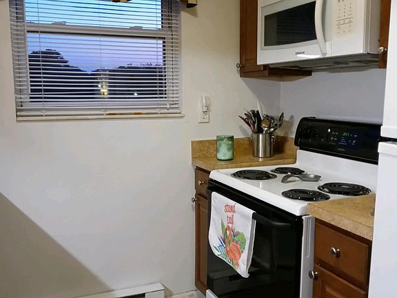 Kitchen with self-cleaning oven