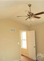 Vaulted Masterbedroom with walk in closet and ceiling fan