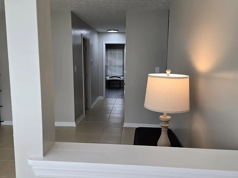 Second view from front door of hallway and bathroom. Hallway closet not pictured - provided additional closet space.
