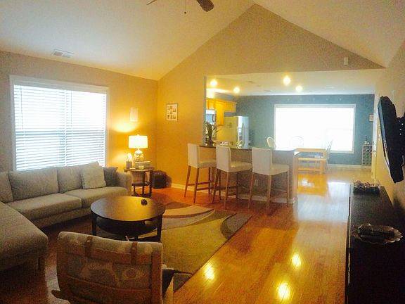 Family room area and open floor plan to kitchen.
