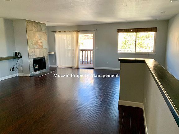2nd floor: Living room, fireplace is not operational. Deck for BBQ use.