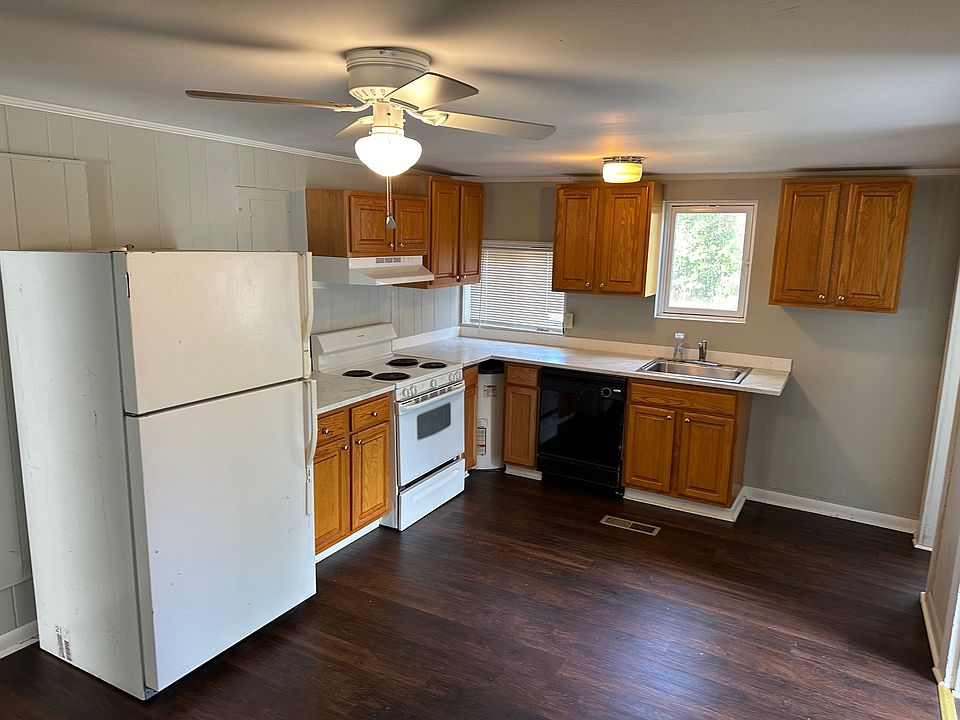 Kitchen with dishwasher, stove and fridge