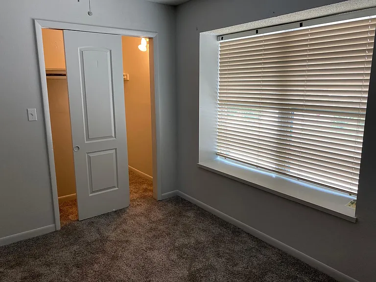 Bedroom 2 upstairs with new high quality carpet and large walk-in closet.
