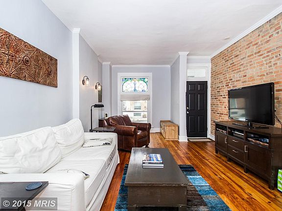 Living Room with Exposed Brick