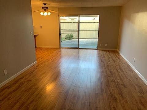 Large living room with sliding glass door to patio