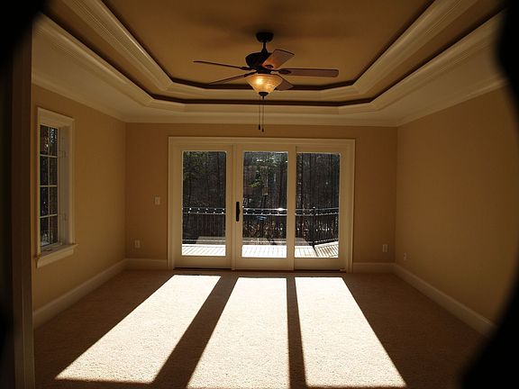 Master Bedroom with lighted double tray ceiling