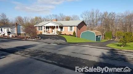FRONT RIGHT SIDE VIEW FROM STREET
						:
						DETACHED 14 X 28 GARAGE/SHED CAN BE SEEN BESIDE NEIGHBORS DIVEWAY.