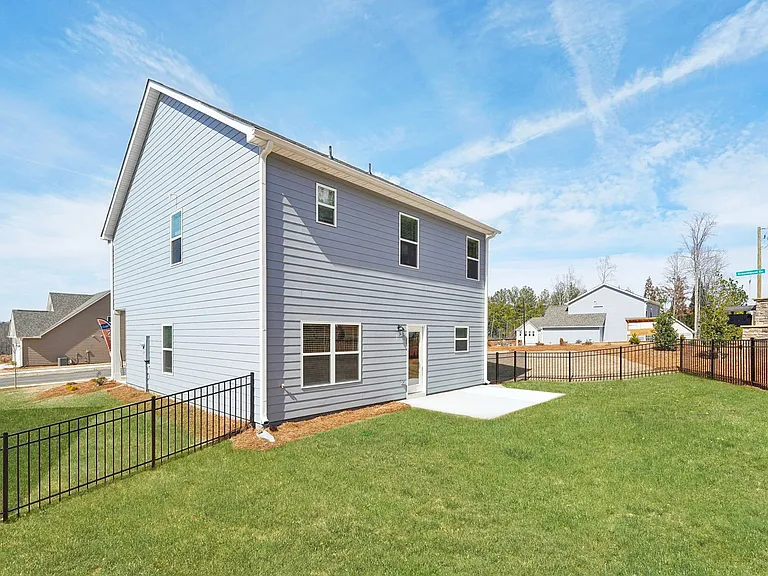 Back patio with fenced in yard.