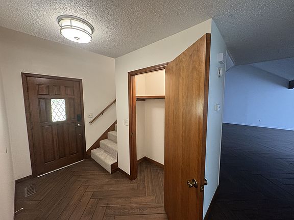 Entry w/coat closet. Living room on right