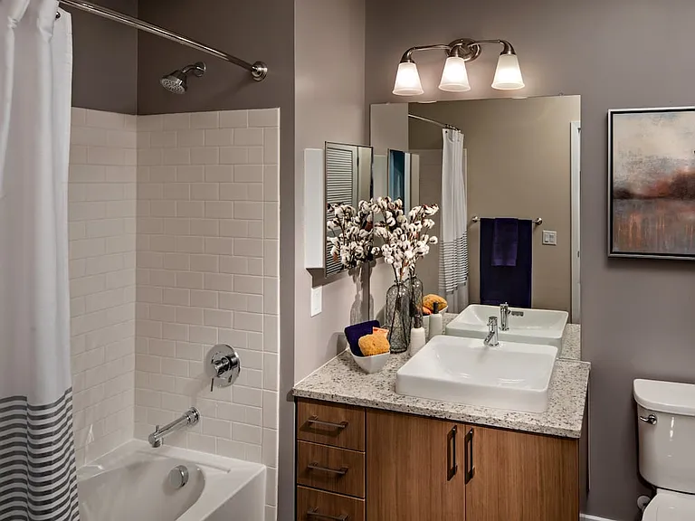 Traditional Collection Bath with oak cabinetry, grey granite countertop, and hard surface flooring