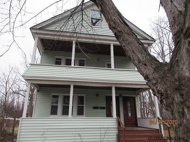 Front of house. Vinyl siding. New windows! Nice porch. No close neighbors.