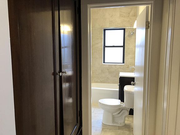 Modern Bathroom and Vintage Cabinetry in the Hallway